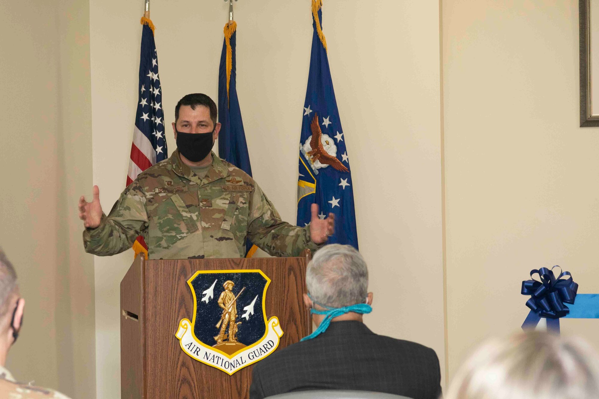 A U.S. Air Force commander speaks at the podium during a ceremony