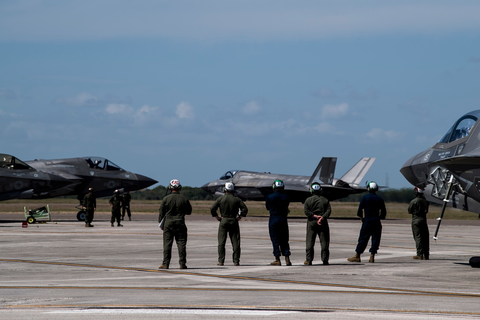 Marines from the 2nd Marine Aircraft Wing look on as an F-35 Lightning II preparing to take-off, March 16, 2021, at MacDill Air Force Base, Fla.