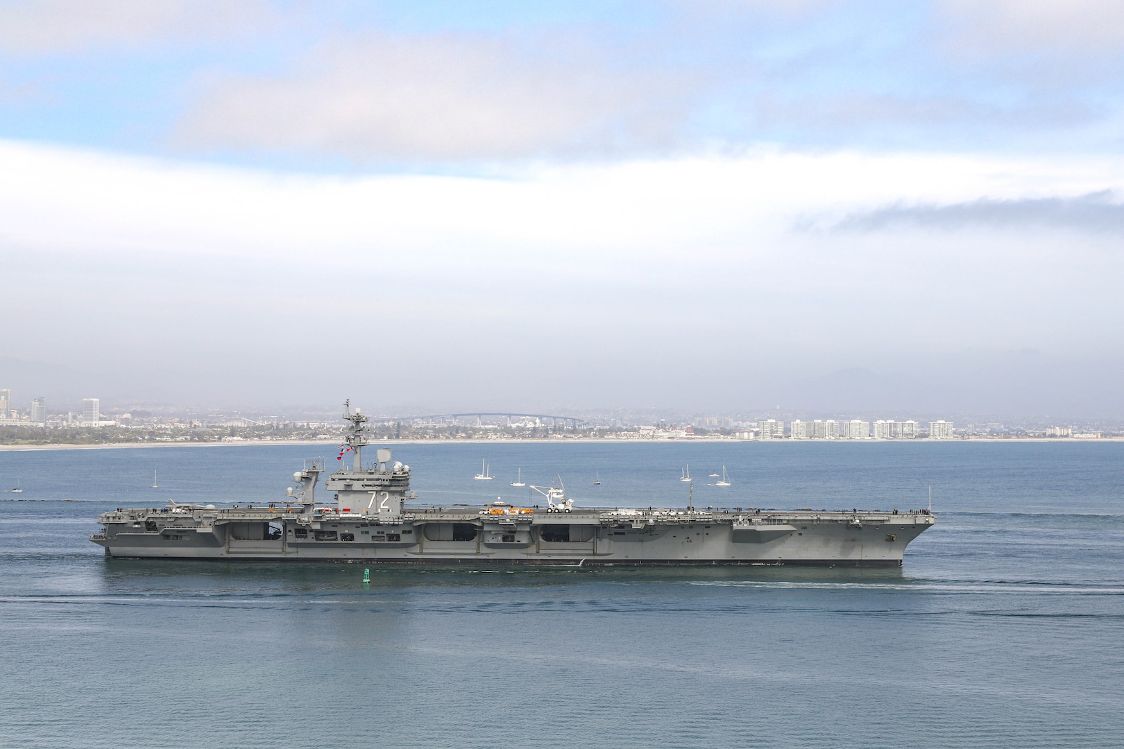 USS Abraham Lincoln (CVN 72) departs San Diego April 5, 2021, headed out to sea trials after undergoing a seven-month Planned Incremental Availability at Puget Sound Naval Shipyard & Intermediate Maintenance Facility's San Diego Detachment. Lincoln successfully completed sea trials April 7, 2021. (PSNS & IMF photo by Robin Lee)