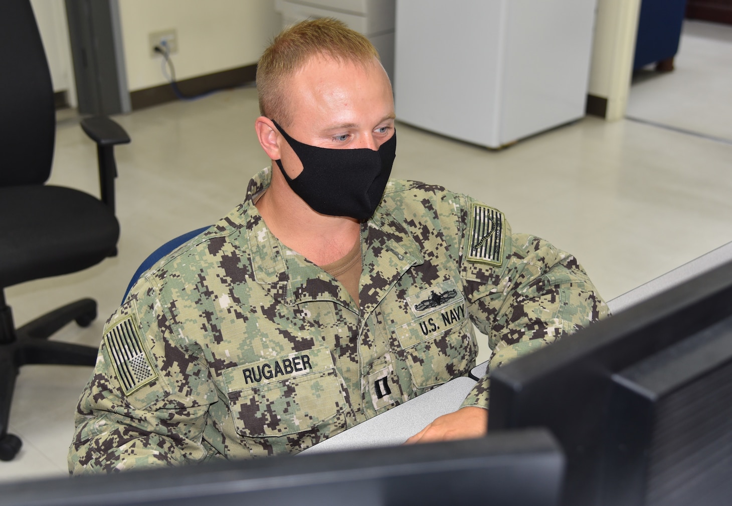 WHITE BEACH, Okinawa- Lt. Glen Rugaber reviews and disseminates information as Battle Watch Captain at Expeditionary Strike Group (ESG) 7. ESG 7 is forward deployed in the U.S. 7th Fleet area of responsibility to enhance interoperability with allies and partners and serve as a ready response force to defend peace and stability in the Indo-Pacific region.