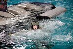 A Kentucky Army National Guard cadet with the University of Kentucky’s ROTC program gasps for air after being under water during advanced underwater egress training March 12, 2021, under the direction of the 160th Special Operations Aviation Regiment’s Dunker Training instructors at Fort Campbell, Ky.