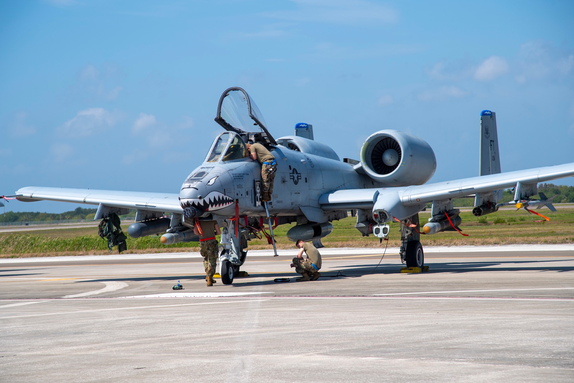 Aircraft maintainers from the 23rd Maintenance Squadron inspect an A-10C Thunderbolt II aircraft assigned to the 74th Fighter Squadron, March 18, 2021, at MacDill Air Force Base, Fla