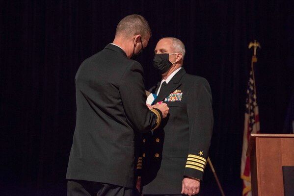 210407-N-MB038-1051 GREAT LAKES, Ill. (Apr. 7, 2021) Rear Adm. John A. Schommer, Commander, Navy Reserve Forces Command, presents Capt. John Molinari an end of tour award during Reserve Component Command Great Lakes change of command ceremony. (US Navy photo by Mass Communication Specialist 2nd Class Christopher Marshall)