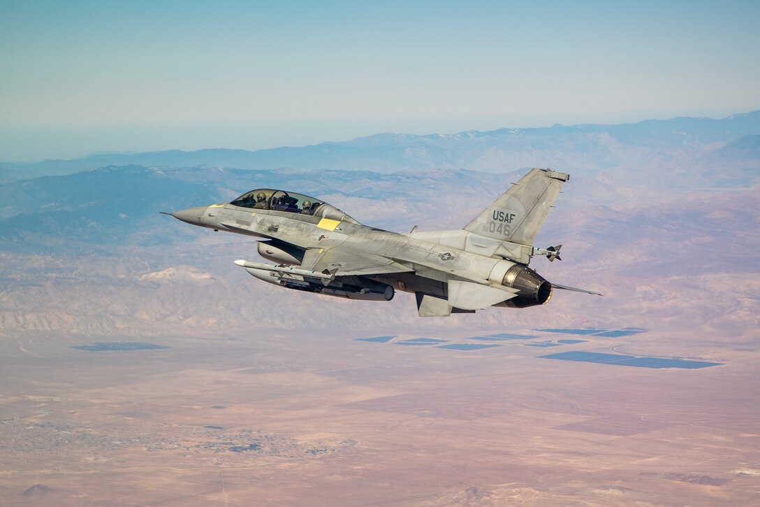 An F-16 assigned to the 416th Flight Test Squadron flies into position over the Precision Impact Range Area on Edwards Air Force Base, California, Feb. 26. The successful drop test was in support of the Korea F-16 Update Program. The ROKAF currently operates 133 KF-16C/D Block 50/52 fighter aircraft, all of which will undergo extensive modernization and upgrades as part of the comprehensive improvement program. Lockheed Martin was awarded a $1.2 billion contract to retrofit the 133 KF-16s and upgrade them to the advanced F-16V configuration, which is the latest technologically and most advanced version of the fourth generation fighter jet. (Air Force photo by Ethan Wagner)