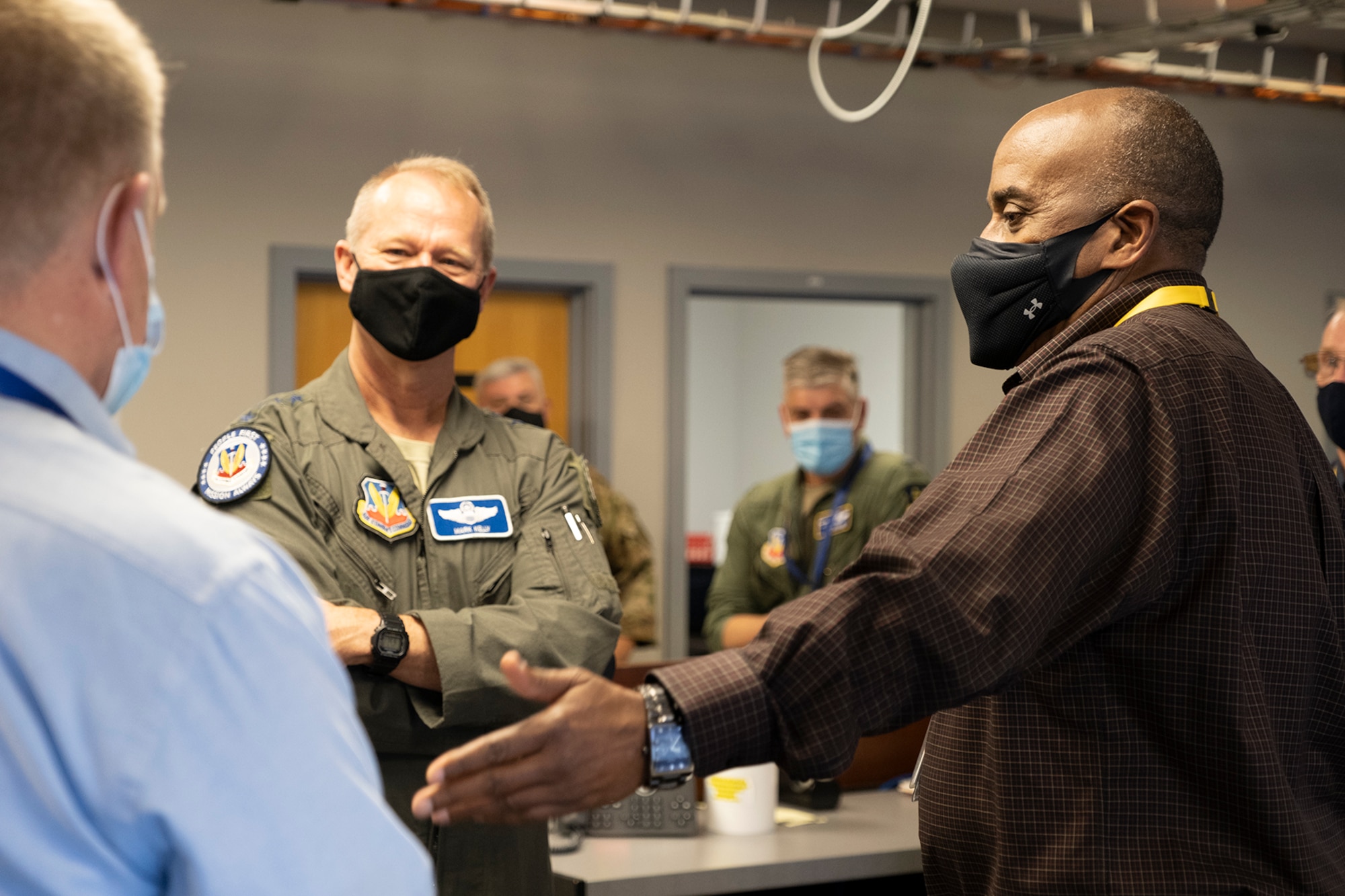 photo of Gen. Kelly talking to two civilians