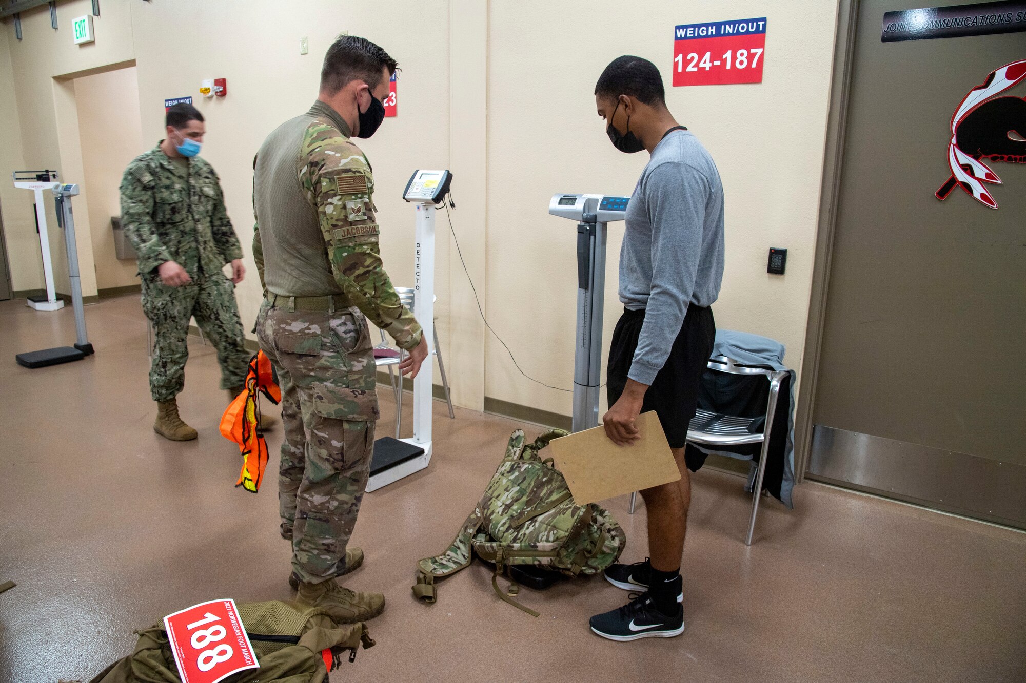 A member of the Joint Communications Support Element weighs his gear before starting the Norwegian Foot March on April 2, 2021, at MacDill Air Force Base, Fla.