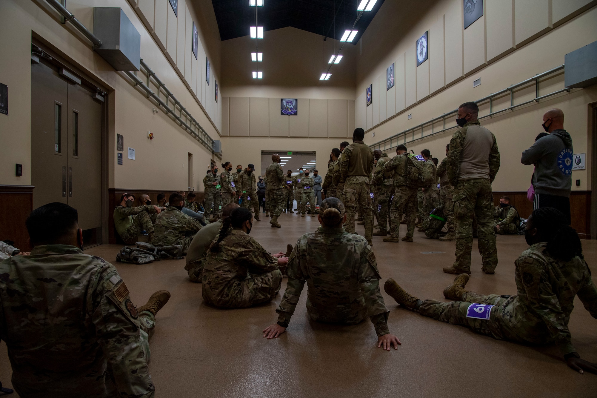 Members of the Joint Communications Support Element gather during a safety brief before the start of the Norwegian Foot March on April 2, 2021, at MacDill Air Force Base, Fla.