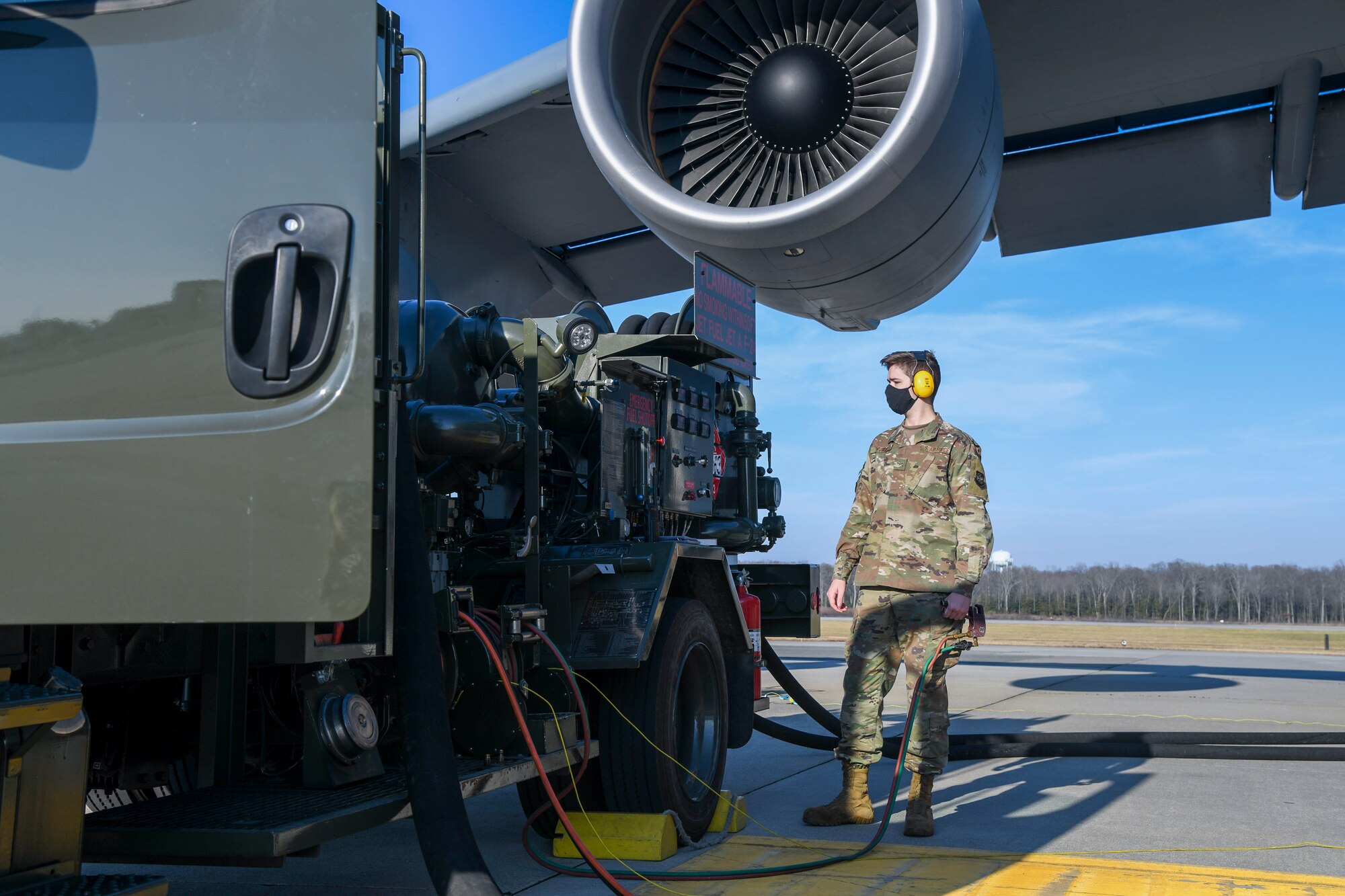 Airman 1st Class Cameron Hurst, 436th Logistics Readiness Squadron mobile distribution operator, reads a control panel on a fuel truck at Dover Air Force Base, Delaware, Jan. 13, 2021. Operators use the panel for important details about the fueling process, including the amount of fuel to be dispensed. (U.S. Air Force photo by Airman 1st Class Stephani Barge)