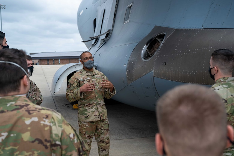 Staff Sgt. Jacorey Grimes, 736th Aircraft Maintenance Squadron crew chief, briefs Team Dover’s Multi-Capable Airmen team about features of a Dover AFB C-17 Globemaster III during exercise Razor Talon at Seymour Johnson AFB, North Carolina, March 22, 2021. The base’s MCA program trained and equipped seven Airmen to perform tasks outside of their Air Force Specialty Codes. Exercises such as RT help integrate MCA into joint and combined expeditionary operations around the globe. (U.S. Air Force photo by Airman 1st Class Faith Schaefer)
