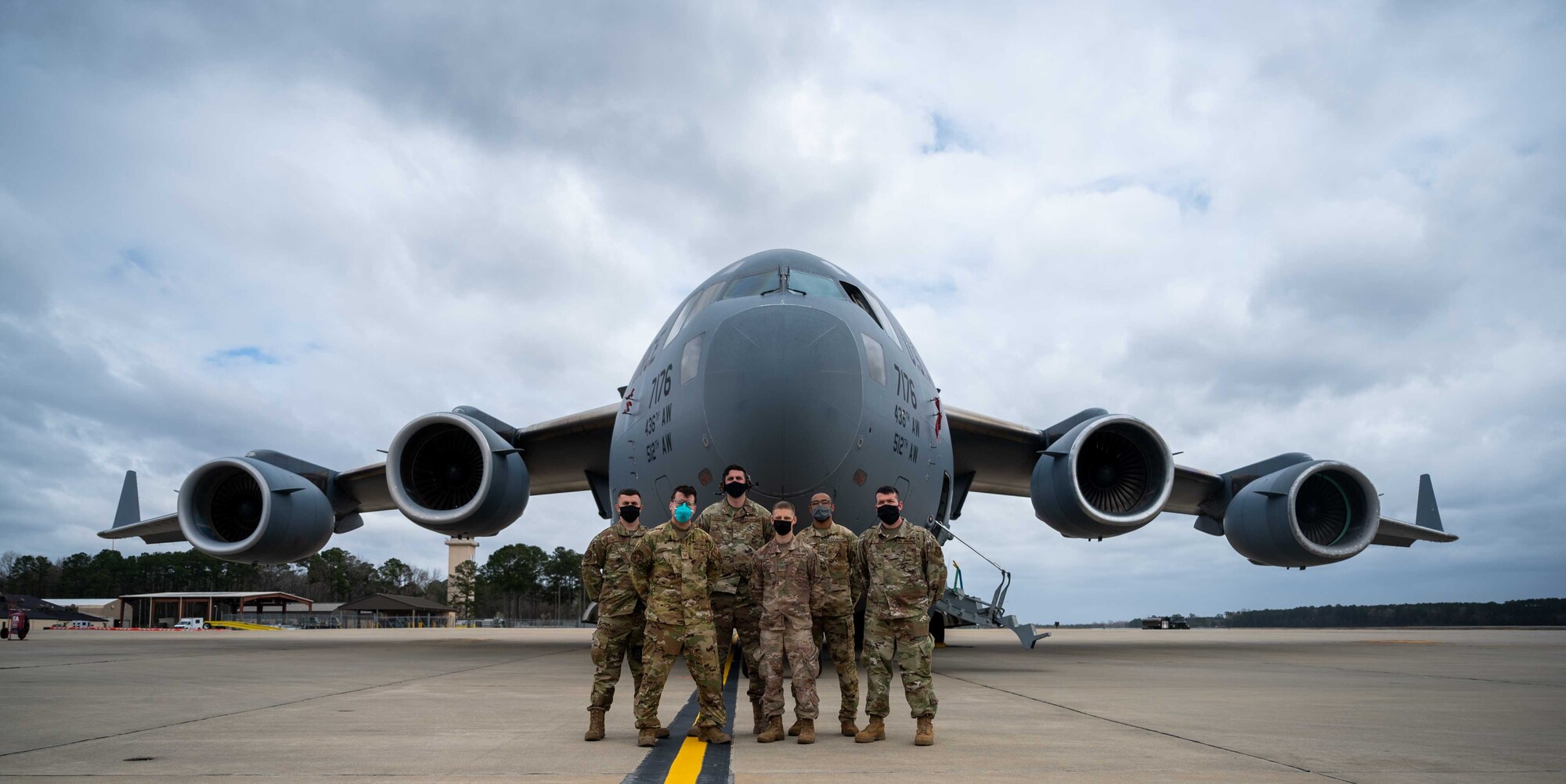 Team Dover’s Multi-Capable Airmen team poses for a photo in front of a Dover AFB C-17 Globemaster III during exercise Razor Talon at Seymour Johnson AFB, North Carolina, March 22, 2021. The base’s MCA program developed and equipped seven Airmen to perform tasks outside of their Air Force Specialty Codes. Exercises such as RT help integrate MCA into joint and combined expeditionary operations around the globe.  (U.S. Air Force photo by Airman 1st Class Faith Schaefer)