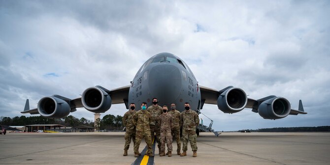 Senior Airman Casey McCune, 3rd Airlift Squadron loadmaster, enters data into a computer as part of pre-flight operations during exercise Razor Talon at Seymour Johnson AFB, North Carolina, March 24, 2021. Mobility Airmen participated in RT to enhance readiness and assist in implementation of the Agile Combat Employment concept across the Air Force. (U.S. Air Force photo by Airman 1st Class Faith Schaefer)