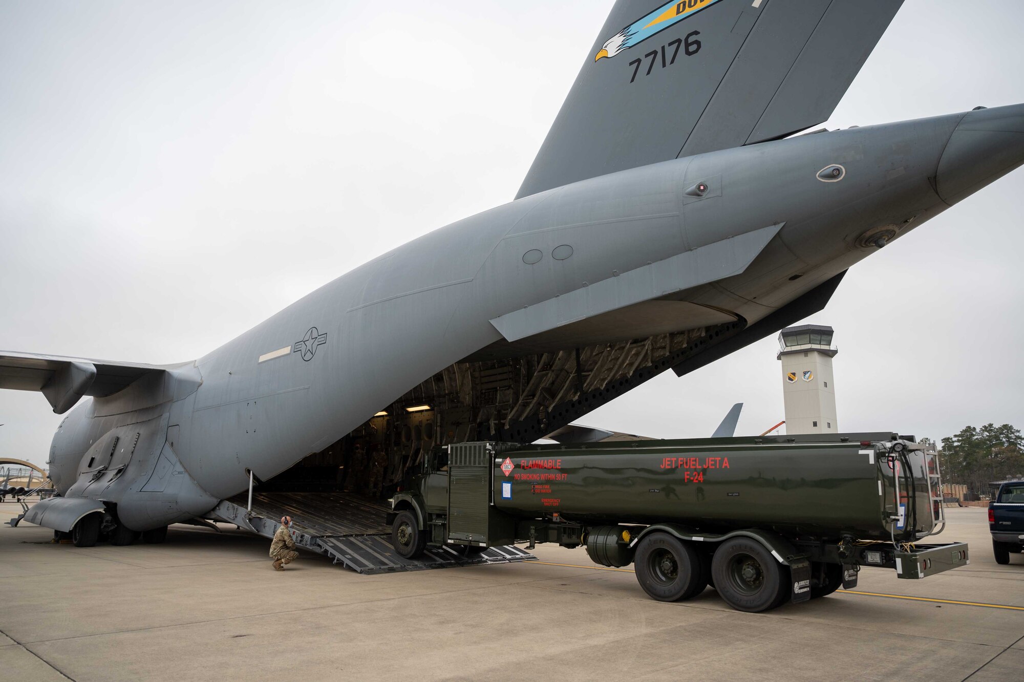 A fuel truck is loaded onto a Dover Air Force Base C-17 Globemaster III during exercise Razor Talon at Seymour Johnson AFB, North Carolina, March 23, 2021. Mobility Airmen participated in exercise Razor Talon to enhance readiness and assist in implementation of the Agile Combat Employment concept across the Air Force. (U.S. Air Force photo by Airman 1st Class Faith Schaefer)