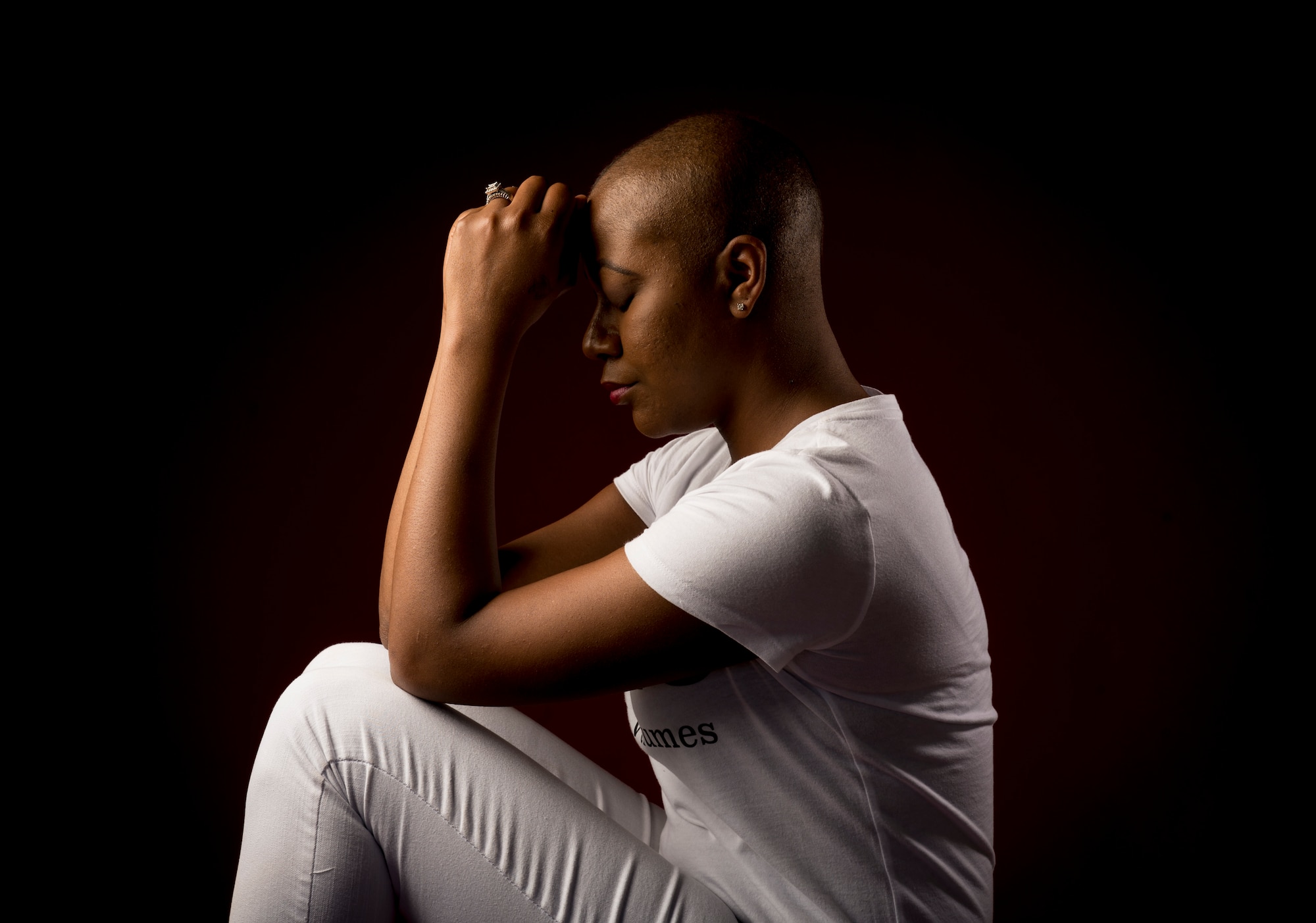 Staff Sgt. Chantel Thibeaux, Joint Base-Fort Sam Houston, Texas, dental assistant instructor, pauses for a moment during a portrait session. Thibeaux, 27, is scheduled to have double mastectomy surgery at the San Antonio Medical Center to remove the cancer from both breasts. (U.S. Air Force photo/Staff Sgt. Vernon Young Jr.)