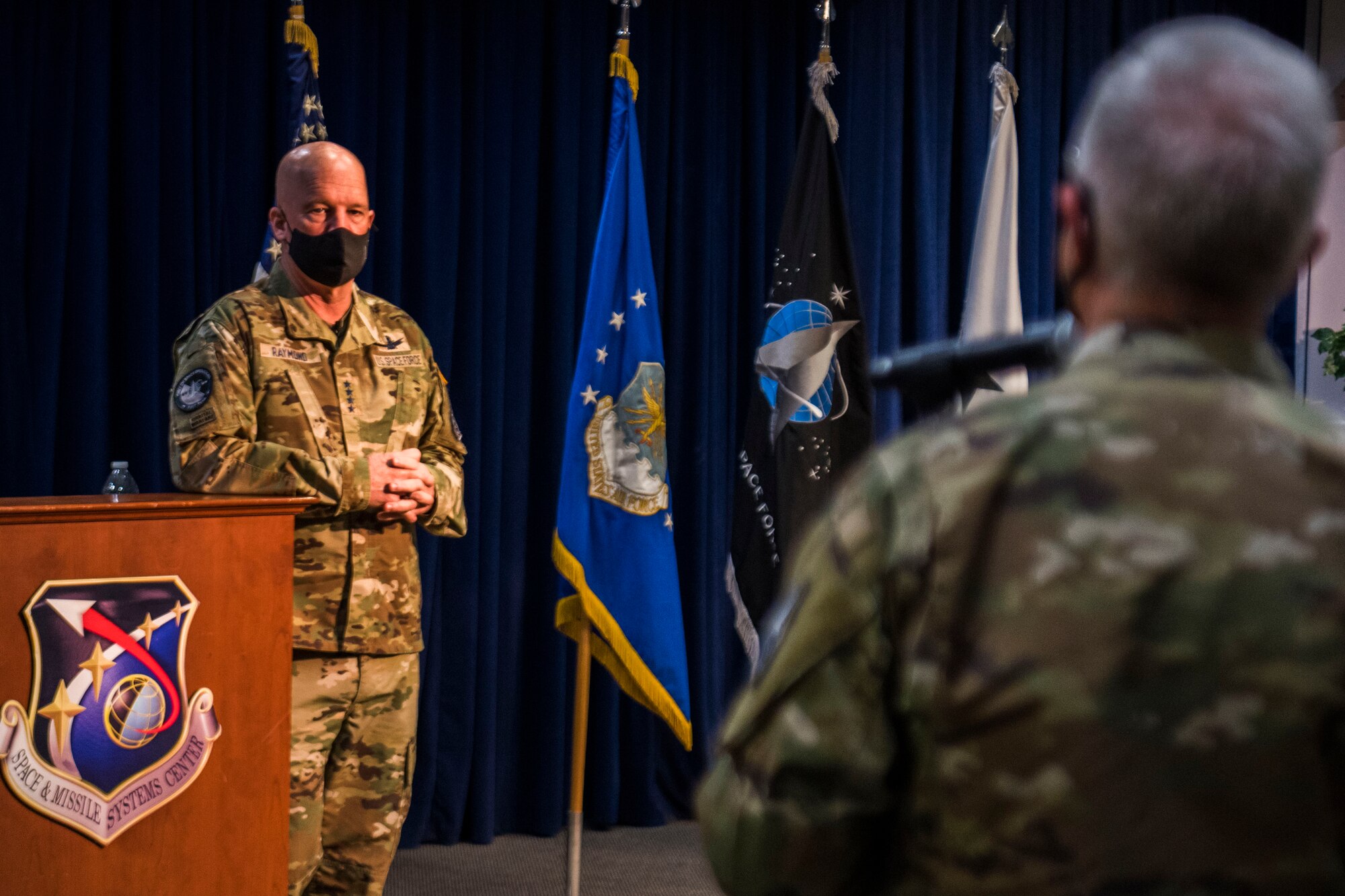 U.S. Air Force Lt. Gen. John F. Thompson, Space and Missile Systems Center commander and Program Executive Officer for Space, right, asks a question of U.S. Space Force Gen. John W. “Jay” Raymond, Chief of Space Operations, during a ‘Q&A’ portion of an all call at Los Angeles Air Force Base, California, April 8, 2021. Scheduled for this summer, the Space & Missile Systems Center will be re-designated as the Space Systems Command, and SMC subordinate units will be realigned to SSC. (U.S. Space Force photo by Staff Sgt. Luke Kitterman)