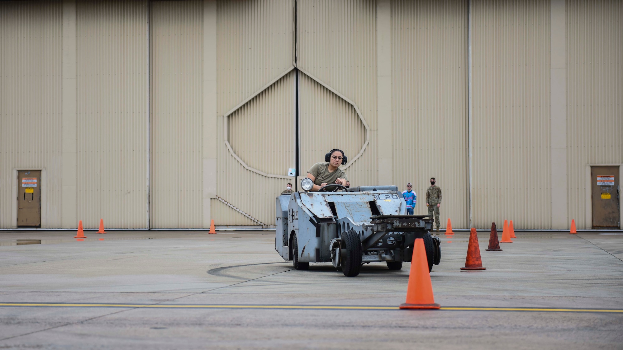 Airman driving a bomb lift