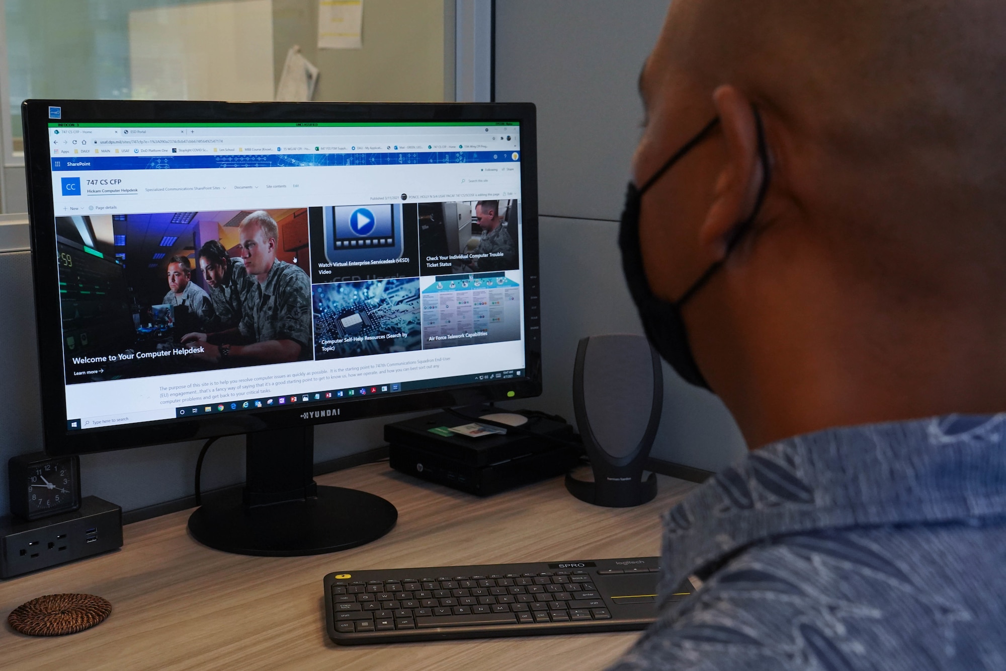 Leo Green, 647th Force Support Squadron management analyst, demonstrates how navigating information on the Communications Focal Point Sharepoint site will improve troubleshooting technical concerns at Joint Base Pearl Harbor-Hickam, Hawaii, April 7, 2021. The CFP helpdesk will give end-users readily available information to assist with fixing cyber-related issues. (U.S. Air Force photo by Senior Airman Jermaine Ayers)