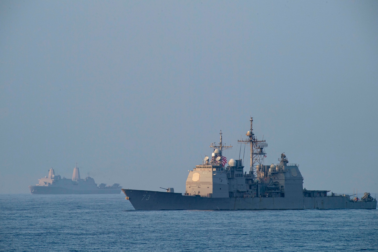 SOUTH CHINA SEA (April 9, 2021) The Ticonderoga-class guided-missile cruiser USS Port Royal (CG 73), right, and the San Antonio-class amphibious transport dock ship USS San Diego (LPD 22) transit in formation with the Theodore Roosevelt Carrier Strike Group and the Makin Island Amphibious Ready Group in the South China Sea April 9, 2021. The Theodore Roosevelt Carrier Strike Group, Makin Island Amphibious Ready Group and Port Royal are conducting expeditionary strike force operations during their deployments to the 7th Fleet area of operations. As the U.S. Navy's largest forward-deployed fleet, 7th Fleet routinely operates and interacts with 35 maritime nations while conducting missions to preserve and protect a free and open Indo-Pacific region. (U.S. Navy photo by Mass Communication Specialist Seaman Eduardo A. Torres)