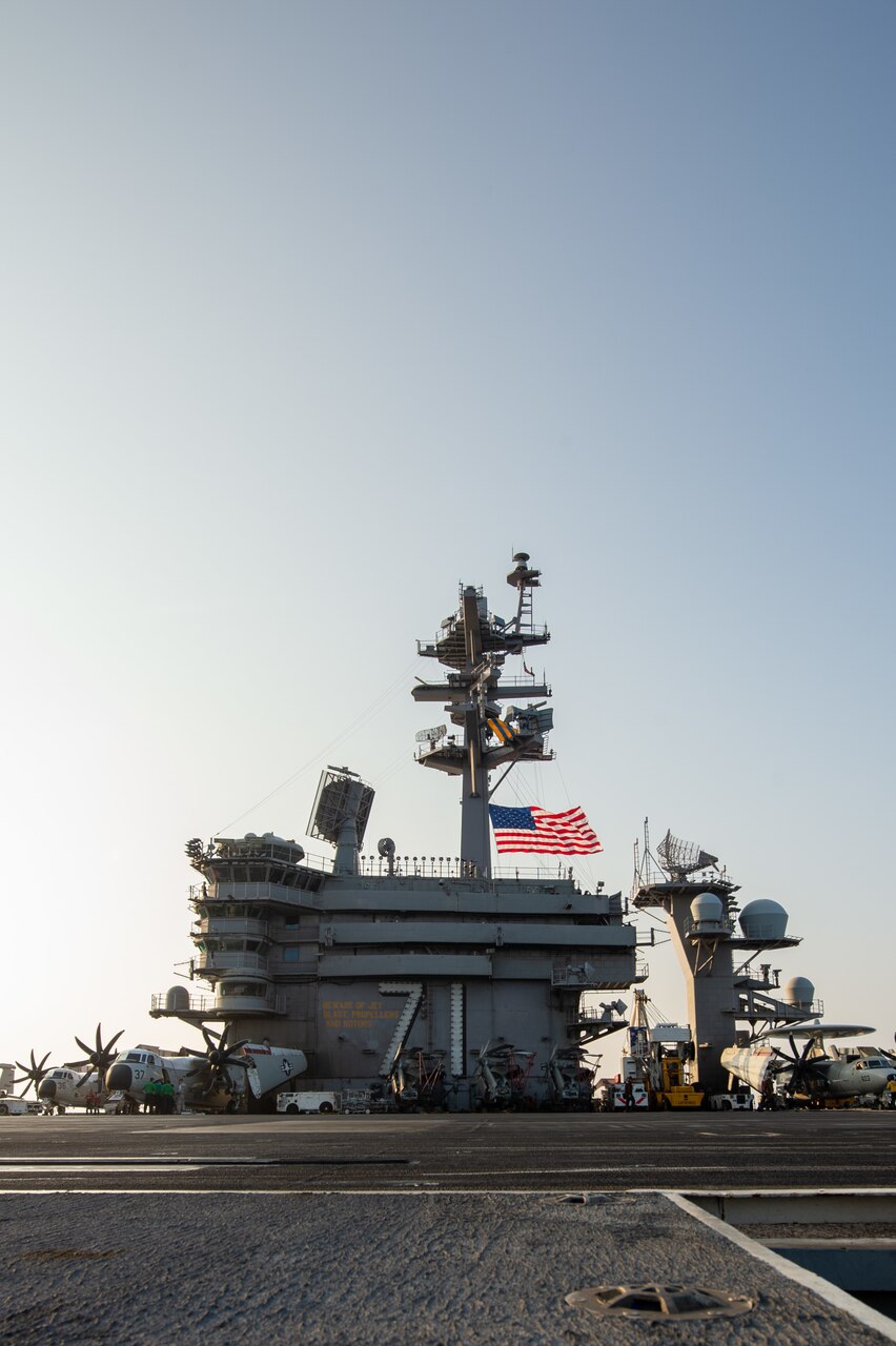 SOUTH CHINA SEA (April 9, 2021) – The aircraft carrier USS Theodore Roosevelt (CVN 71) flies the American flag as it transits the South China Sea with the Makin Island Amphibious Ready Group April 9, 2021. The Theodore Roosevelt Carrier Strike Group, Makin Island Amphibious Ready Group and the Ticonderoga-class guided-missile cruiser USS Port Royal (CG 73) are conducting expeditionary strike force operations during their deployments to the 7th Fleet area of operations. As the U.S. Navy's largest forward-deployed fleet, 7th Fleet routinely operates and interacts with 35 maritime nations while conducting missions to preserve and protect a free and open Indo-Pacific region. (U.S. Navy photo by Mass Communication Specialist 3rd Class Dartanon D. De La Garza)