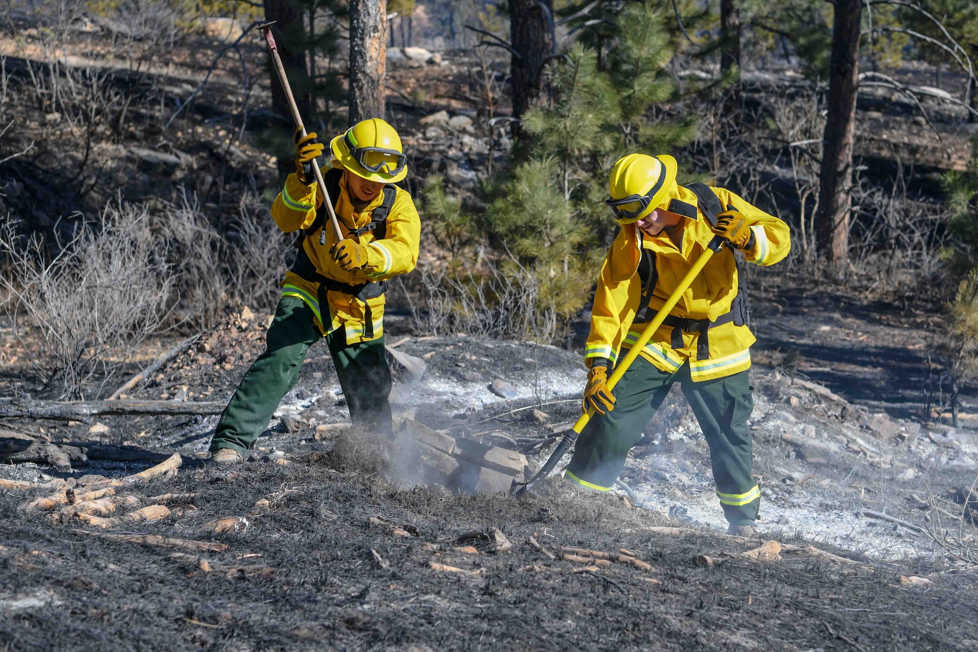 South Dakota National Guard firefighters break up the ground to help alleviate hot spots from Schroeder’s Fire in Rapid City, S.D., March 30, 2021. Several members assigned to the 216th and 451st Firefighting Detachments were called in to help support containment efforts on the ground.