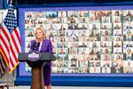 First Lady Dr. Jill Biden announces the priorities of the newly relaunched Joining Forces initiative at the White House, April 7, 2021. She is surrounded by monitors showing the virtual audience for the event.