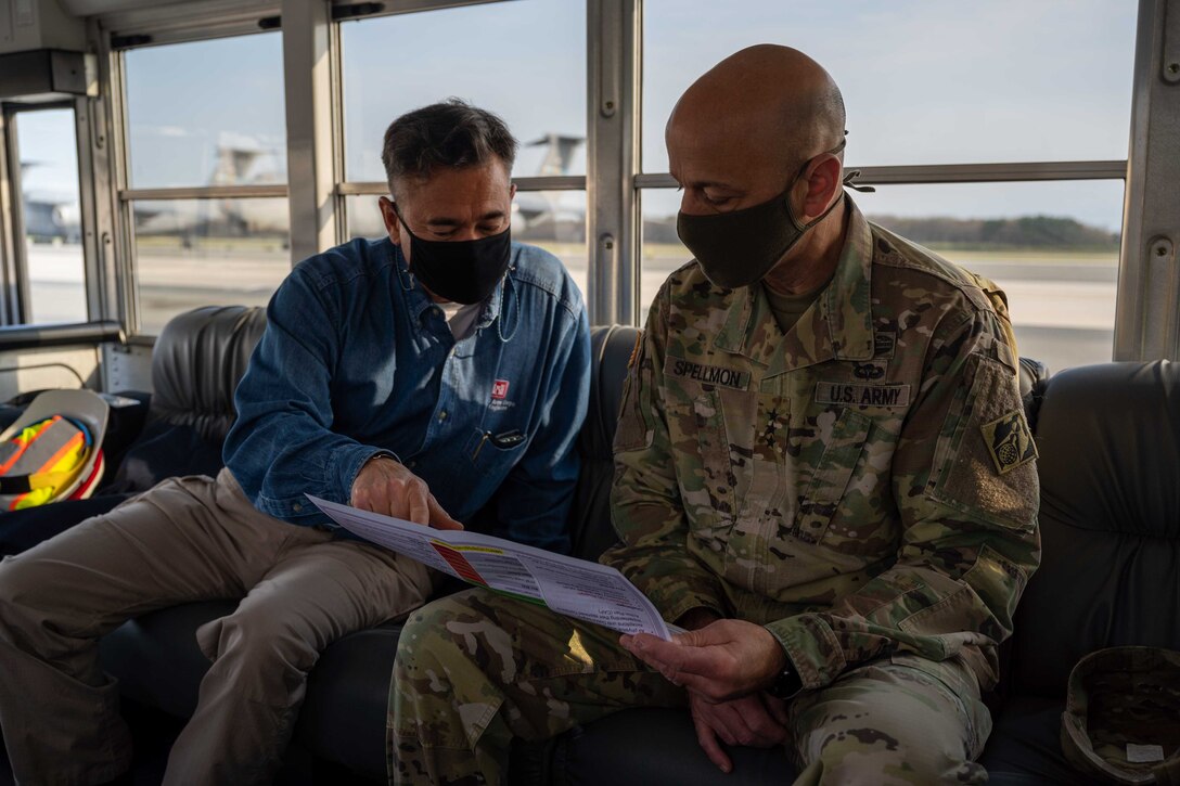 Tom Lavender, U.S. Army Corps of Engineers project manager at the Dover Air Force Base office, explains current base construction with U.S. Army Lt. Gen. Scott A. Spellmon, 55th Chief of Engineers, U.S. Army Corps of Engineers commanding general, at Dover AFB, Delaware, April 7, 2021. During his visit, Spellmon toured two facilities, totaling about $89.2 million, that are currently under construction management by the Corps. (U.S. Air Force photo by Airman 1st Class Faith Schaefer)