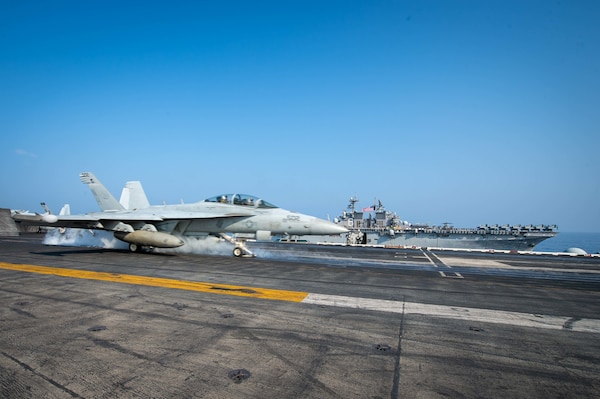 SOUTH CHINA SEA (April 9, 2021) – An EA-18G Growler, assigned to the “Gray Wolves” of Electronic Attack Squadron (VAQ) 142, launches from the flight deck of the aircraft carrier USS Theodore Roosevelt (CVN 71) in the South China Sea April 9, 2021. The Theodore Roosevelt Carrier Strike Group, Makin Island Amphibious Ready Group and the Ticonderoga-class guided-missile cruiser USS Port Royal (CG 73) are conducting expeditionary strike force operations during their deployments to the 7th Fleet area of operations. As the U.S. Navy's largest forward-deployed fleet, 7th Fleet routinely operates and interacts with 35 maritime nations while conducting missions to preserve and protect a free and open Indo-Pacific region. (U.S. Navy photo by Mass Communication Specialist 3rd Class Dartañon D. De La Garza)
