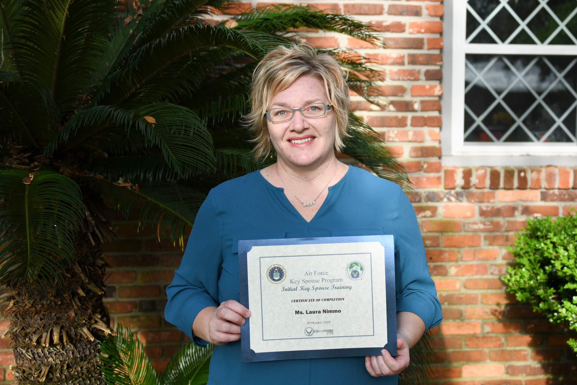 Photo of person holding a certificate
