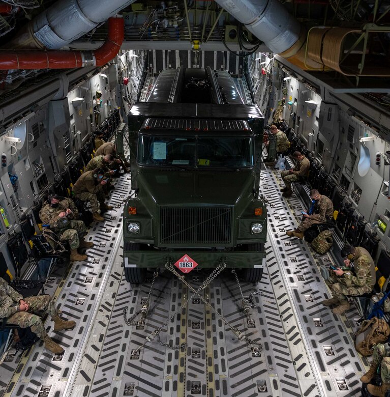 A fuel truck and passengers fly on a Dover Air Force Base C-17 Globemaster III during exercise Razor Talon at Seymour Johnson AFB, North Carolina, March 23, 2021. Mobility Airmen participated in Razor Talon to enhance readiness and assist in implementation of the Agile Combat Employment concept across the Air Force.