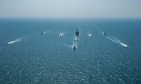 Royal Bahrain Naval Force fast attack craft RBNS Abdul Rahman Al-fadel (P 22), Bahrain Coast Guard response boats Hawar 5 and Hawar 4, U.S. Navy guided-missile destroyer USS Mahan (DDG 72), patrol coastal ships USS Squall (PC 7) and USS Hurricane (PC 3), U.S. Coast Guard patrol boat USCGC Adak (WBP 1333) and two Mark VI patrol boats operate in formation during exercise Neon Defender in the Arabian Gulf, April 7. Neon Defender 21 is a bilateral maritime exercise between the U.S. and Bahrain, designed to enhance interoperability and readiness, fortify military-to-military relationships and advance operational capabilities, allowing participating naval forces to effectively develop the necessary skills to address threats to regional security, freedom of navigation and the free flow of commerce. (Army Photo by Spc. Evens Milcette Jr.)