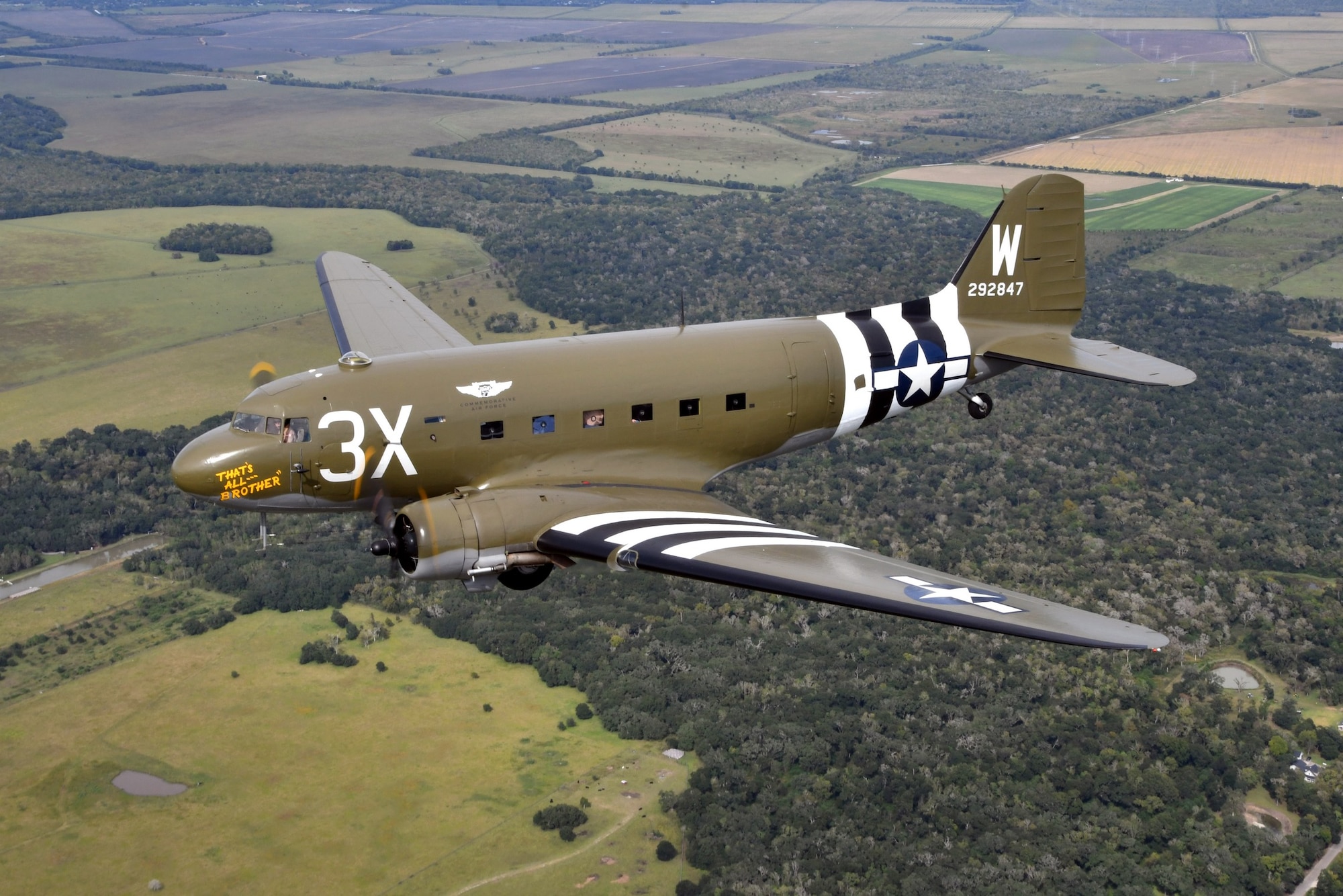 Aerial picture of the C-47 "That's All, Brother" flying.