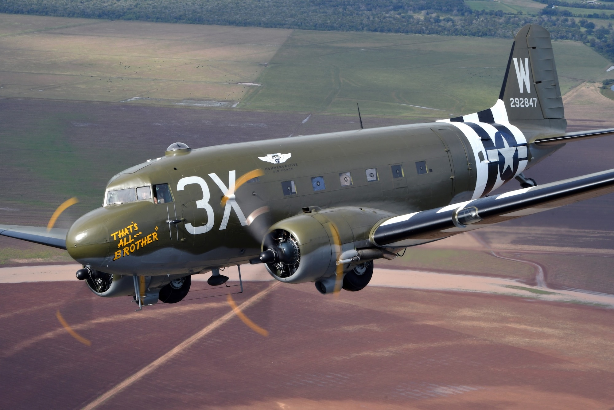Aerial picture of the C-47 "That's All, Brother" flying.