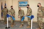 U.S. military leaders cutting a ribbon during a ceremony