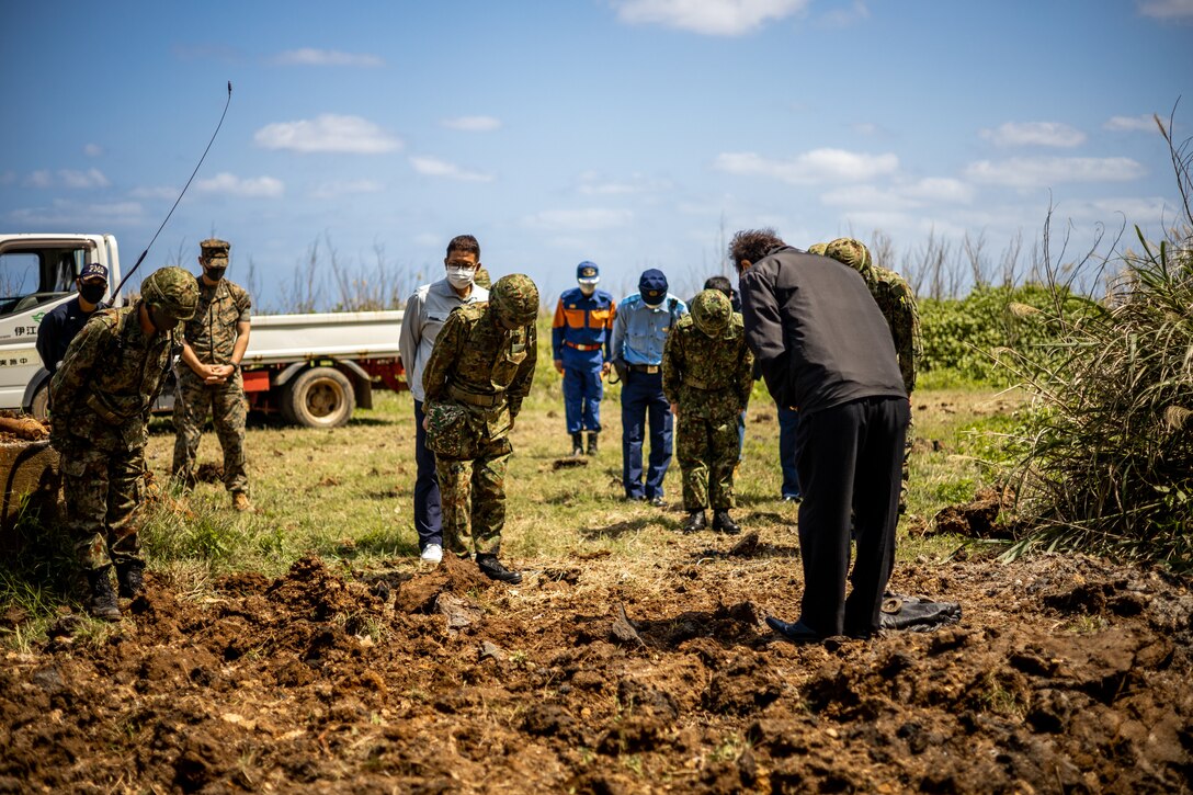 Hideyuki Shimabukuro, the Ie Village office mayor, expresses gratitude towards the Japan Ground Self-Defense Force and Marine Corps Installations Pacific personnel on Ie Shima Training Facility (ISTF), Okinawa, Japan, April 6, 2021. Over the past five years, ordnance has been collected on Iejima and stored away. At the request of the Ie Village office mayor, the JGSDF and Marine Corps Installations Pacific explosive ordnance disposal technicians conducted combined unexploded ordnance disposal operations to destroy the collected ordnance. ISTF is the only active demolition range aboard Iejima where the operation can be conducted. (U.S. Marine Corps photo by Cpl. Terry Wong)