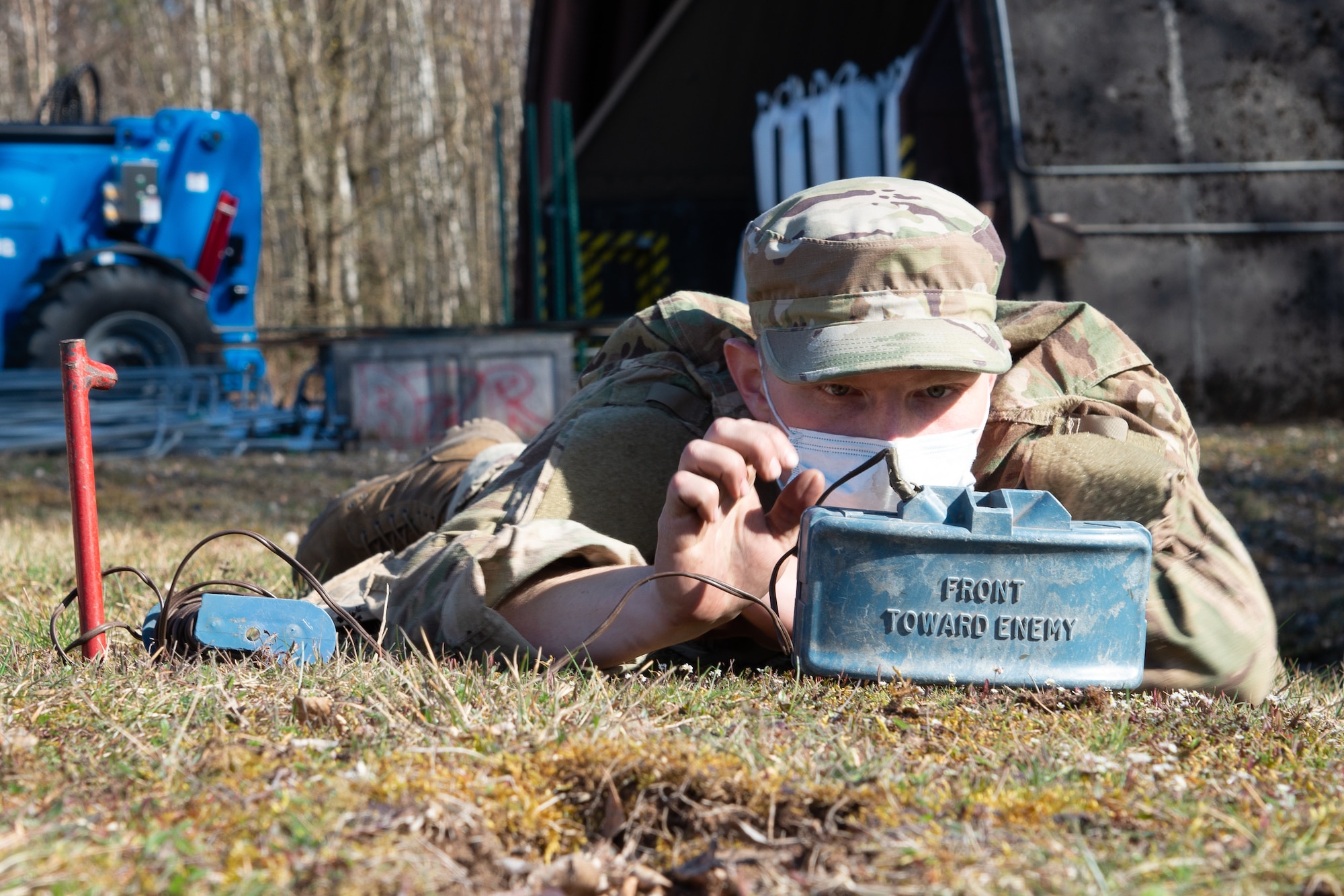 Man inserts a blasting cap into a military mine