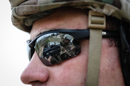 A U.S. Army Reserve Soldier watches Spc. Daniel P. Bush, Jr., a civil affairs specialist with the 418th Civil Affairs Battalion, fire a Mk 19 automatic grenade launcher during day one of the 2021 U.S. Army Civil Affairs and Psychological Operations Command (Airborne) Best Warrior Competition at Fort Jackson, S.C., April 8, 2021. The USACAPOC(A) BWC is an annual event that brings in competitors from across USACAPOC(A) to earn the title of “Best Warrior.” BWC tests the Soldiers’ individual ability to adapt and overcome challenging scenarios and battle-focused events, testing their technical and tactical skills under stress and extreme fatigue.