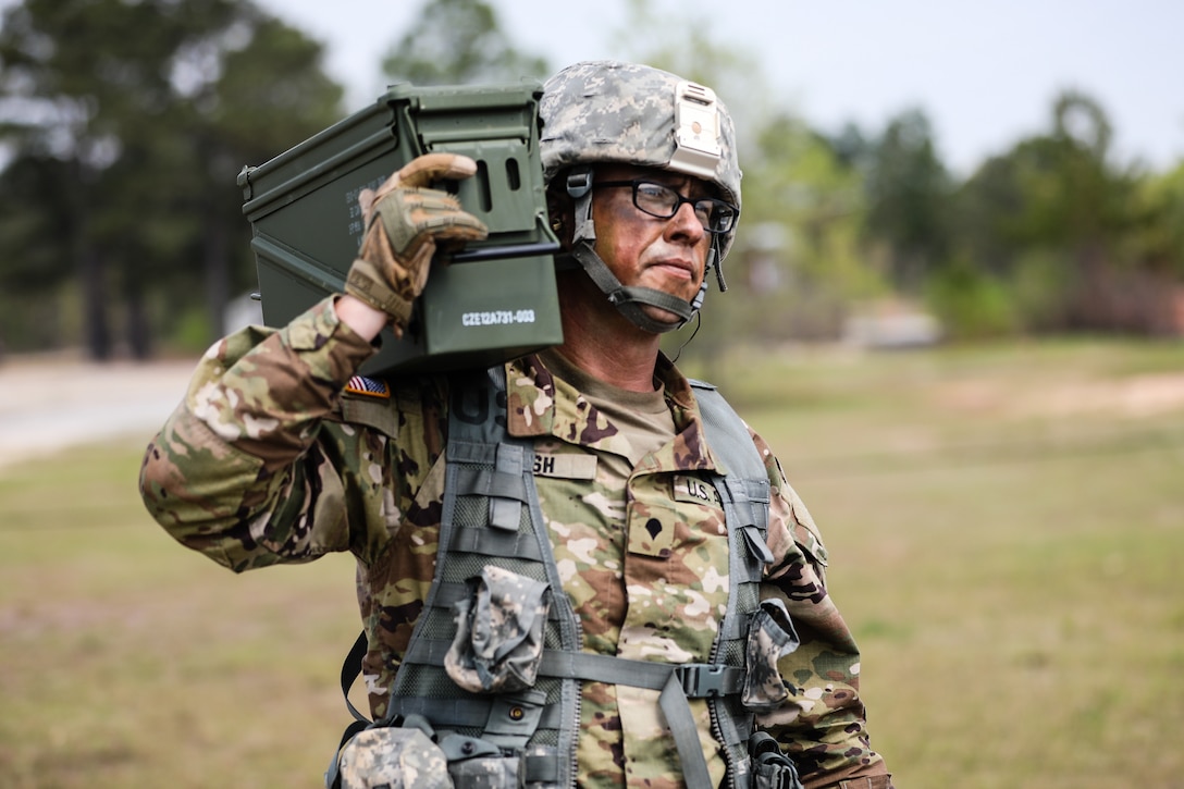 U.S. Army Reserve Spc. Daniel P. Bush Jr., a civil affairs specialist with the 418th Civil Affairs Battalion, carries ammunition during day one of the 2021 U.S. Army Civil Affairs and Psychological Operations Command (Airborne) Best Warrior Competition at Fort Jackson, S.C., April 8, 2021. The USACAPOC(A) BWC is an annual event that brings in competitors from across USACAPOC(A) to earn the title of “Best Warrior.” BWC tests the Soldiers’ individual ability to adapt and overcome challenging scenarios and battle-focused events, testing their technical and tactical skills under stress and extreme fatigue.