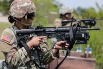 U.S. Army Reserve Spc. Arianna Hammel, a intelligence analyst with the 15th Psychological Operations Battalion fires an M320 grenade launcher during day one of the 2021 U.S. Army Civil Affairs and Psychological Operations Command (Airborne) Best Warrior Competition at Fort Jackson, S.C., April 8, 2021. The USACAPOC(A) BWC is an annual event that brings in competitors from across USACAPOC(A) to earn the title of “Best Warrior.” BWC tests the Soldiers’ individual ability to adapt and overcome challenging scenarios and battle-focused events, testing their technical and tactical skills under stress and extreme fatigue.