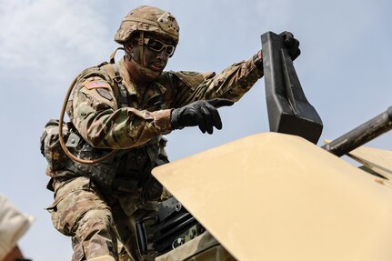 U.S. Army Reserve Staff Sgt. Jonathan Chacon, right, a civil affairs specialist with the 426th Civil Affairs Battalion (Airborne), prepares to fire a Mk 19 automatic grenade launcher, during day one of the 2021 U.S. Army Civil Affairs and Psychological Operations Command (Airborne) Best Warrior Competition at Fort Jackson, S.C., April 8, 2021. The USACAPOC(A) BWC is an annual event that brings in competitors from across USACAPOC(A) to earn the title of “Best Warrior.” BWC tests the Soldiers’ individual ability to adapt and overcome challenging scenarios and battle-focused events, testing their technical and tactical skills under stress and extreme fatigue.