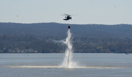 New York Army National Guard helicopter pilots, crews and Soldiers with 3rd Assault Helicopter Battalion,142nd Aviation Regiment, 42nd Combat Aviation Brigade, 42nd Infantry Division, conduct water bucket training using UH-60M and UH-60L Black Hawk helicopters April 6, 2021. The training was at Camp Smith Training Site and over the Hudson River.