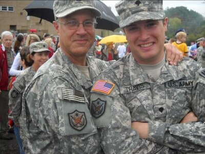 Father and son share the Army Unit Patch Multinational Forces-Iraq after their deployments to Iraq. Staff Sgt. John ‘Jordan’ Travis, domestic operations management support, emergency operations center, NCOIC, deployed in 2009. His father, retired Col. William ‘Terry’ Travis, deployed in 2006.