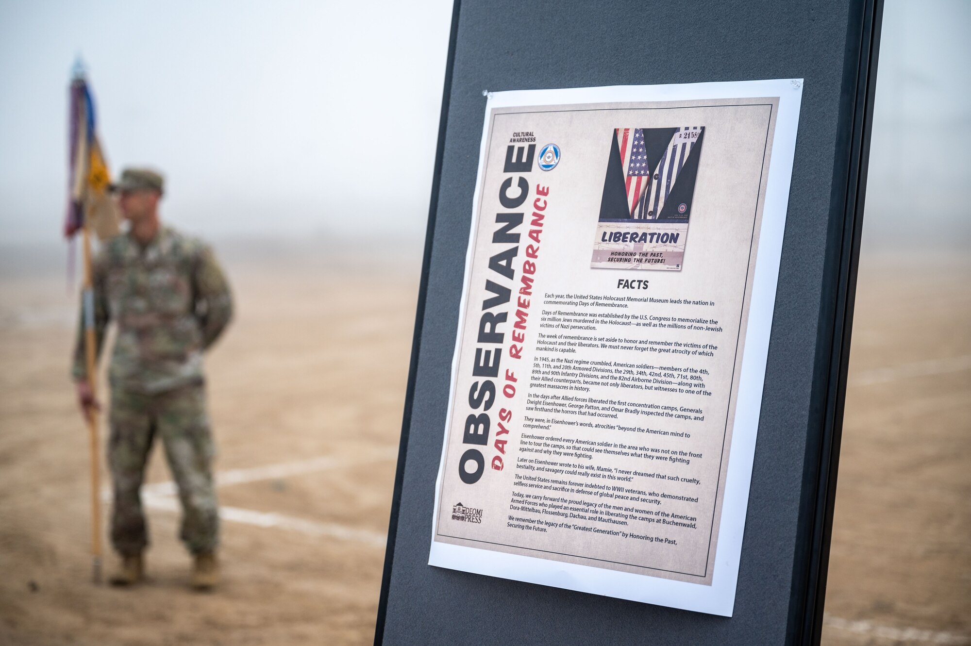 A fact sheet is displayed at a Holocaust Days of Remembrance walk