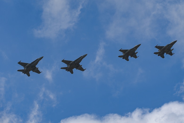 Two U.S. Air Force F-16 Fighting Falcons from the 510th Fighter Squadron and two Spanish air force F-18s fly in formation over Andravida Air Base, Greece, April 7, 2021. The Spanish air force and the 510th FS arrived in Greece to participate in INIOCHOS 21. Participation in INIOHOS 21 helps U.S. Air Force pilots develop and improve air readiness and interoperability with allied and partner air forces. (U.S. Air Force photo by Airman 1st Class Thomas S. Keisler IV)