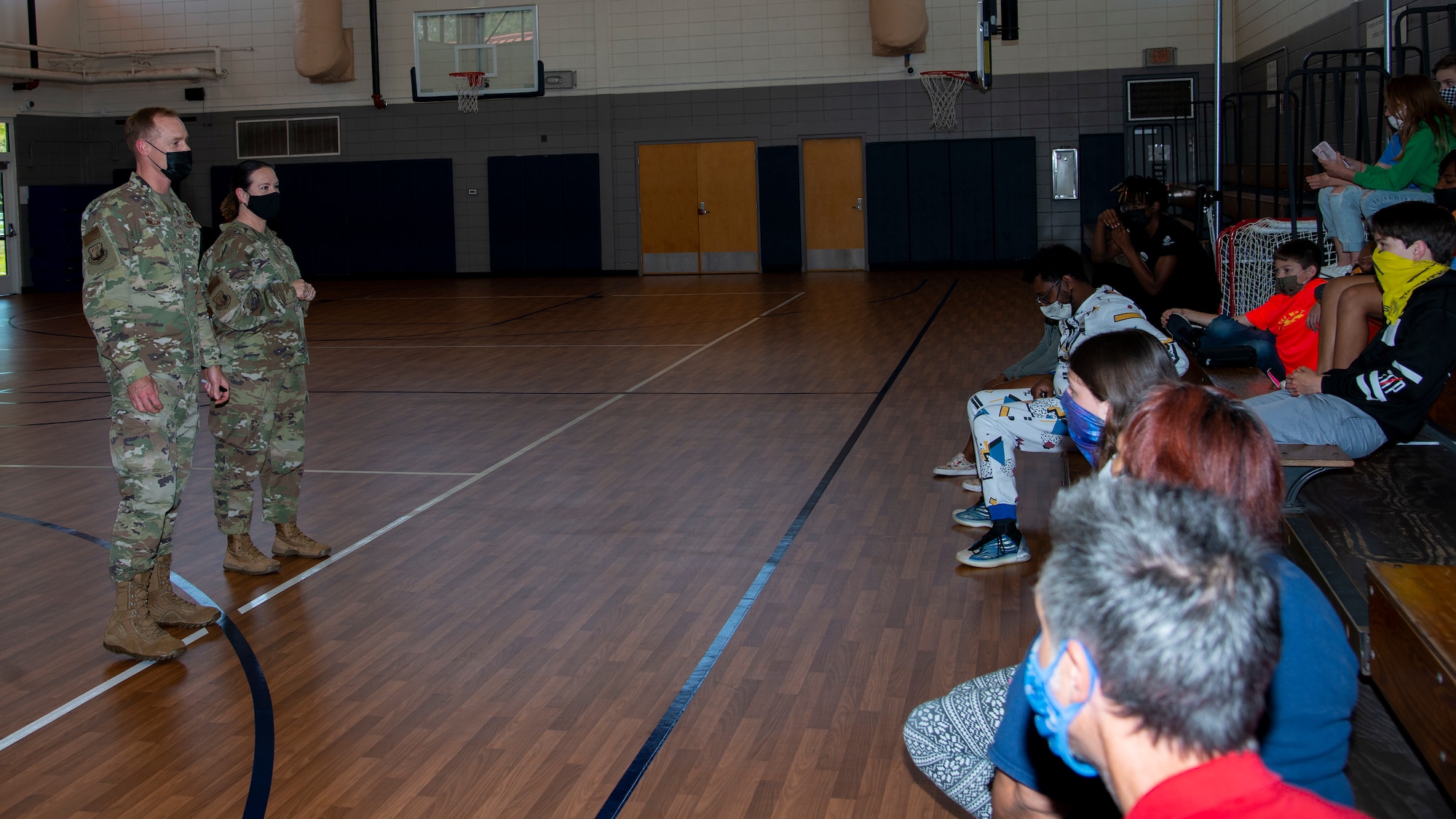 U.S. Air Force Col. Benjamin Jonsson, 6th Air Refueling Wing (ARW) commander, and Chief Master Sgt. Shae Gee, 6 ARW command chief, speak to youth center students at MacDill Air Force Base, Fla., April 5, 2021.