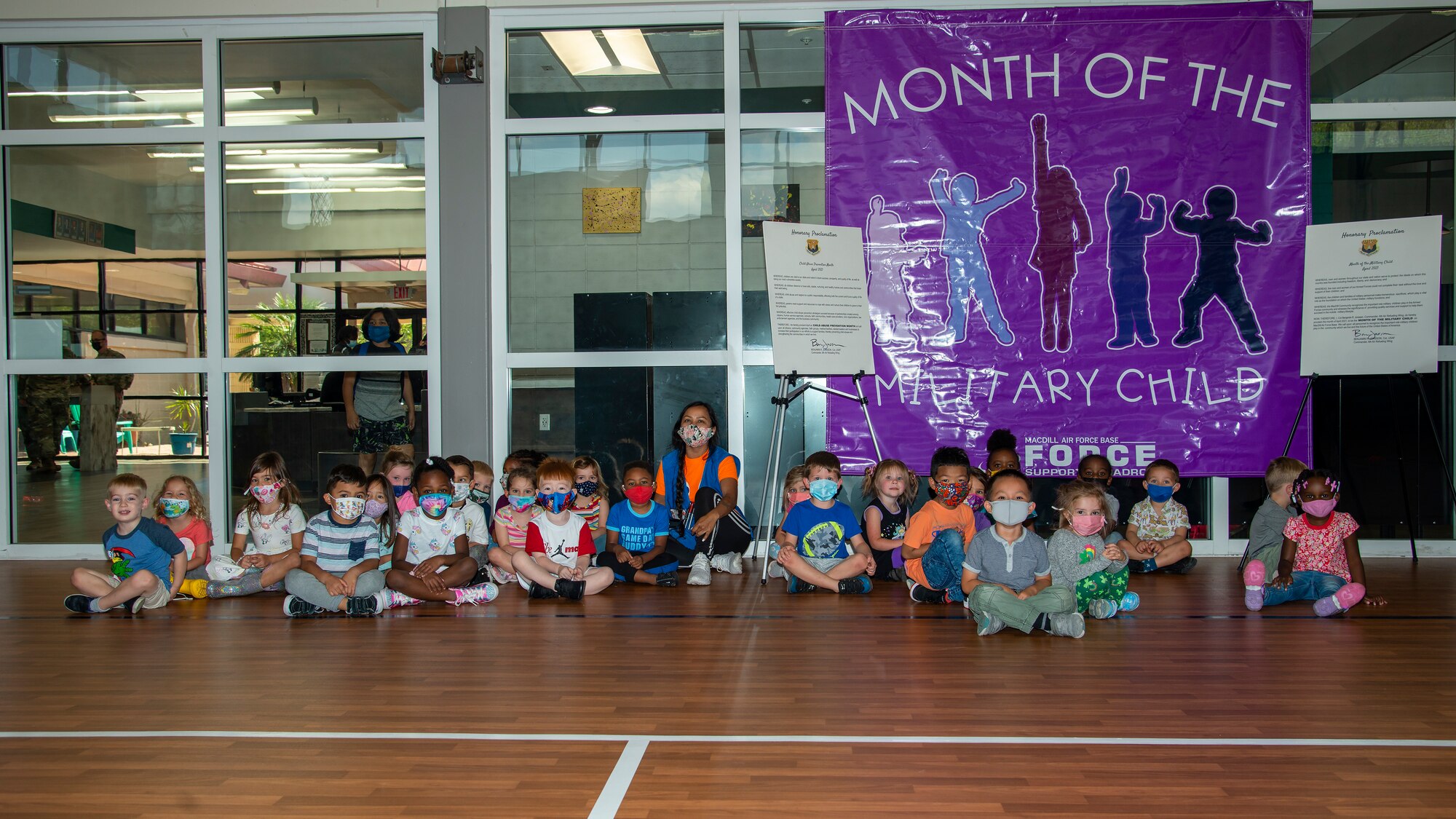 Military dependent children gather for a group photo at the youth center at MacDill Air Force Base, Fla., April 5, 2021.