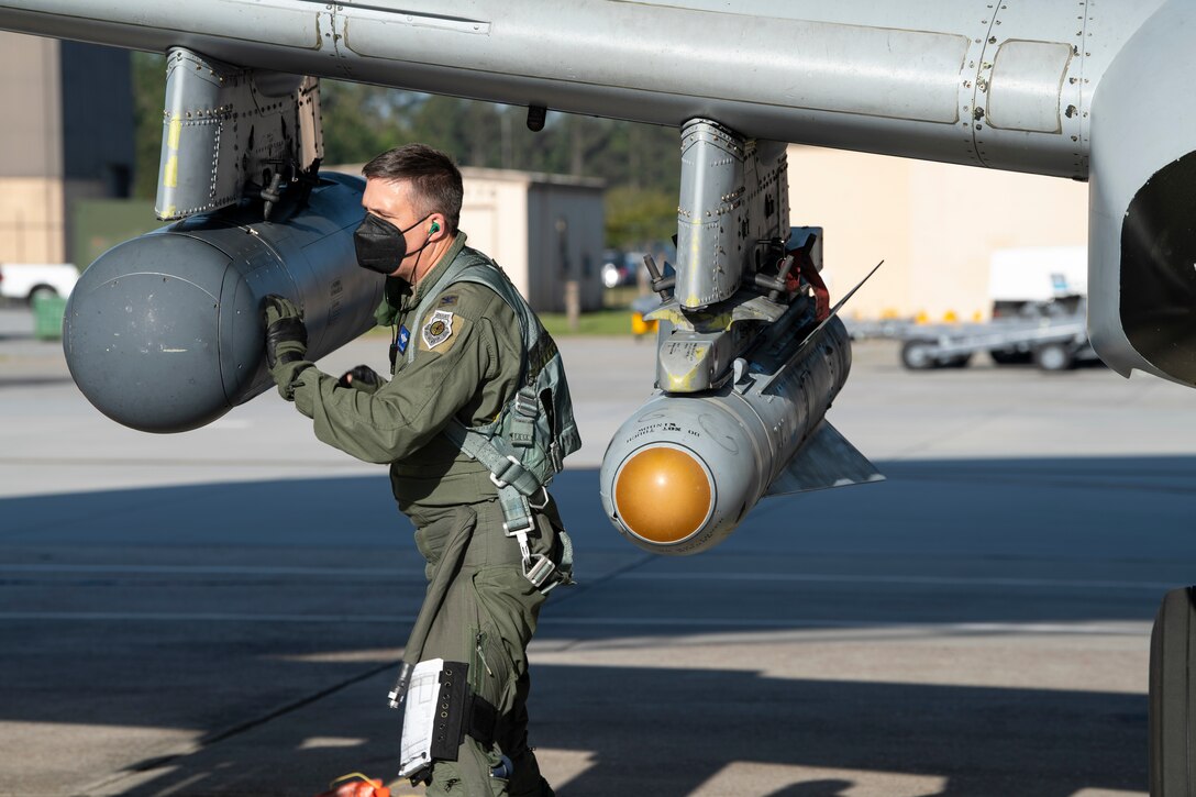 A photo of an Airman inspecting an A-10C Thunderbolt II.