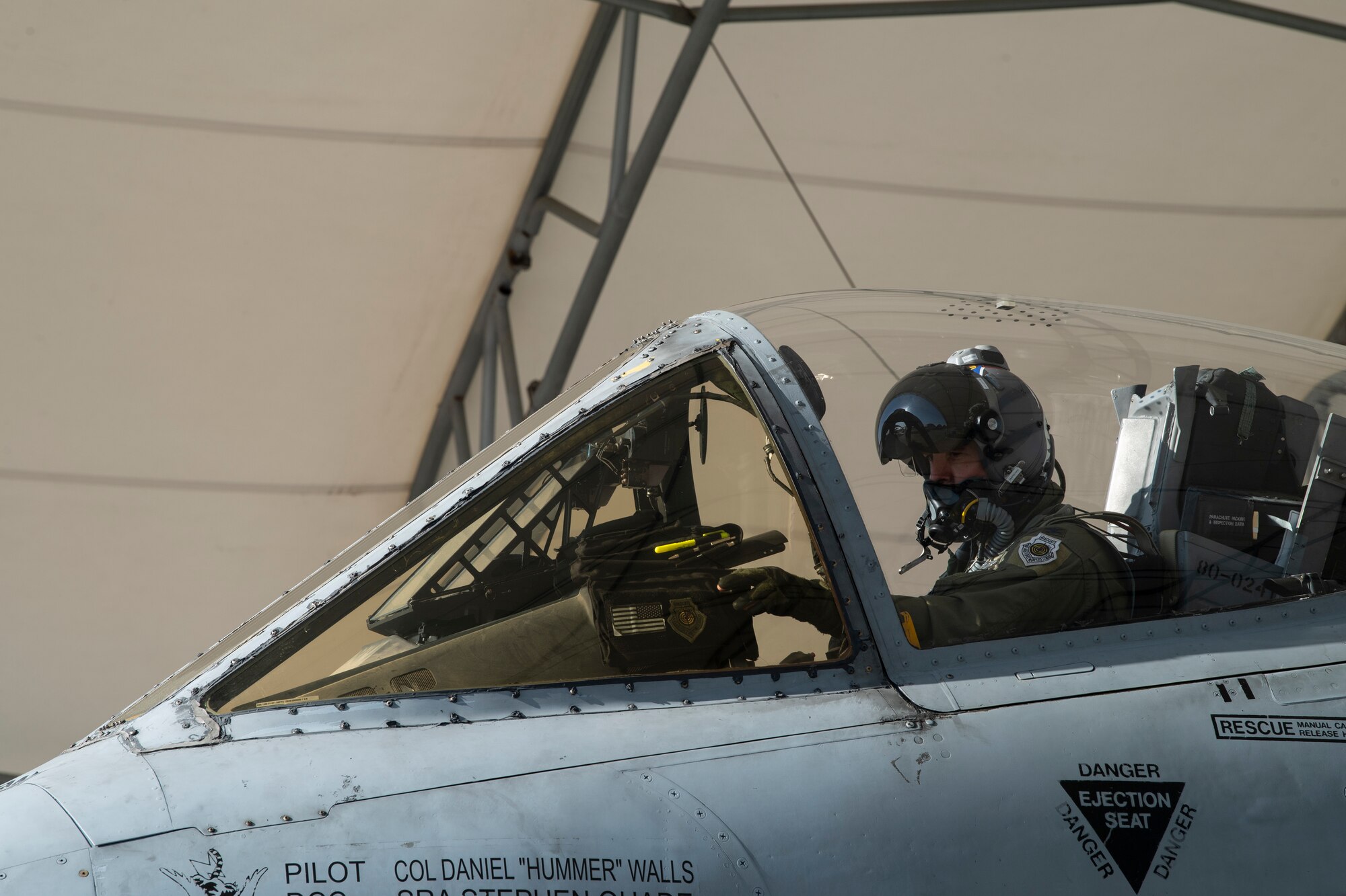 A photo of an Airman siting in an A-10C Thunderbolt II.