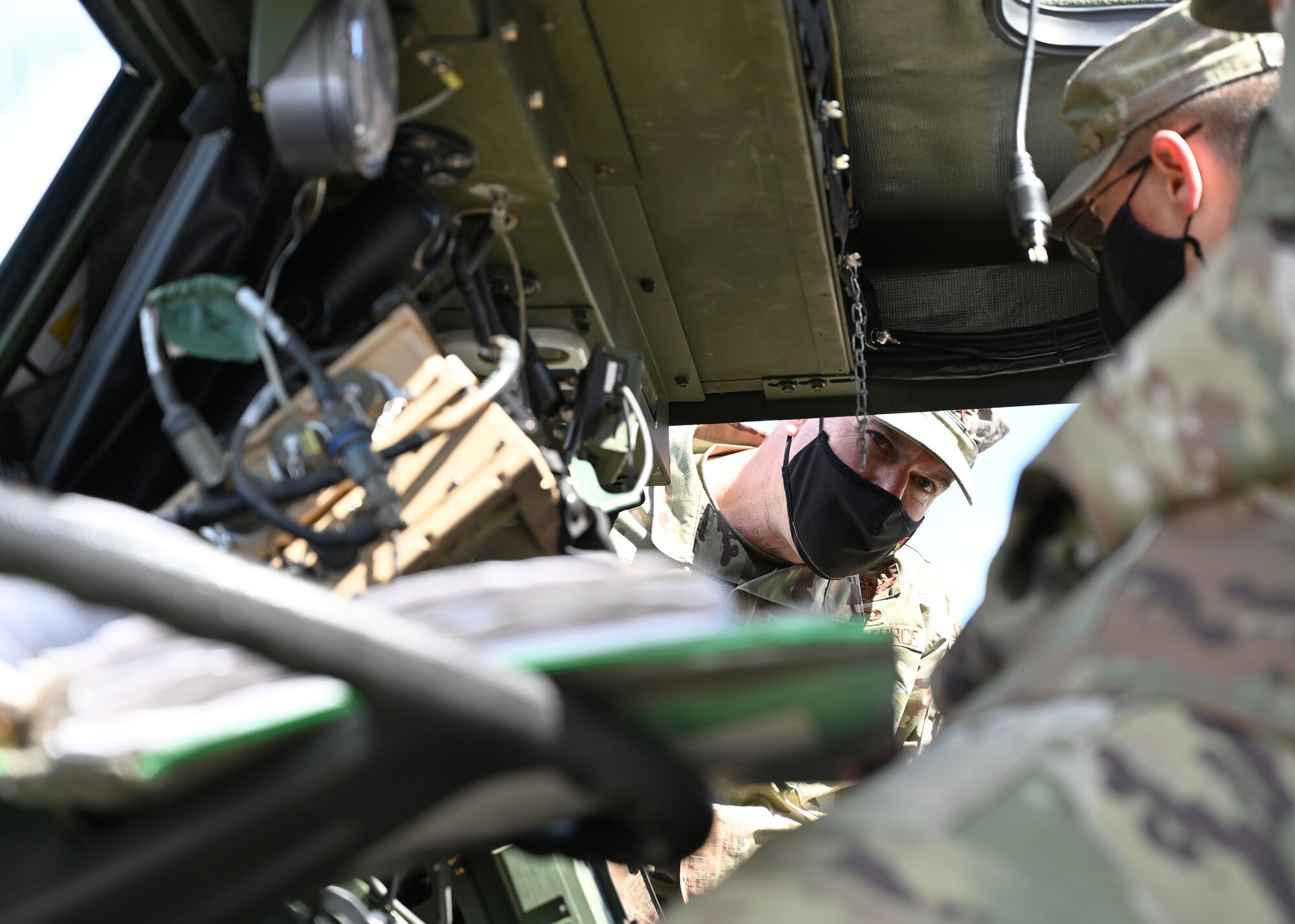 U.S. Air Force Maj. Gen. Thad Bibb, 18th Air Force commander, looks inside a U.S. Army Stryker at Joint Base Lewis-McChord, Washington, April 8, 2021. As part of JBLM, Team McChord Airmen receive several opportunities to work closely alongside Soldiers in multiple training, exercises, missions and operations.  (U.S. Air Force photo by Airman 1st Class Callie Norton)