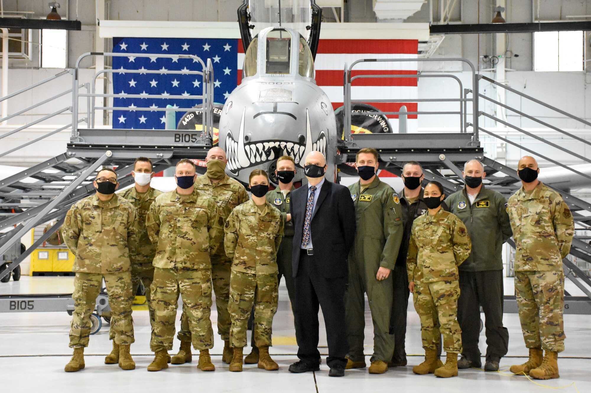 Award winners and their supervisors pose for a group photo with Acting Secretary of the Air Force John Roth after receiving coins.