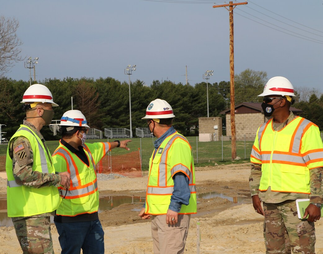 Team members tour a construction project at Dover Air Force Base.