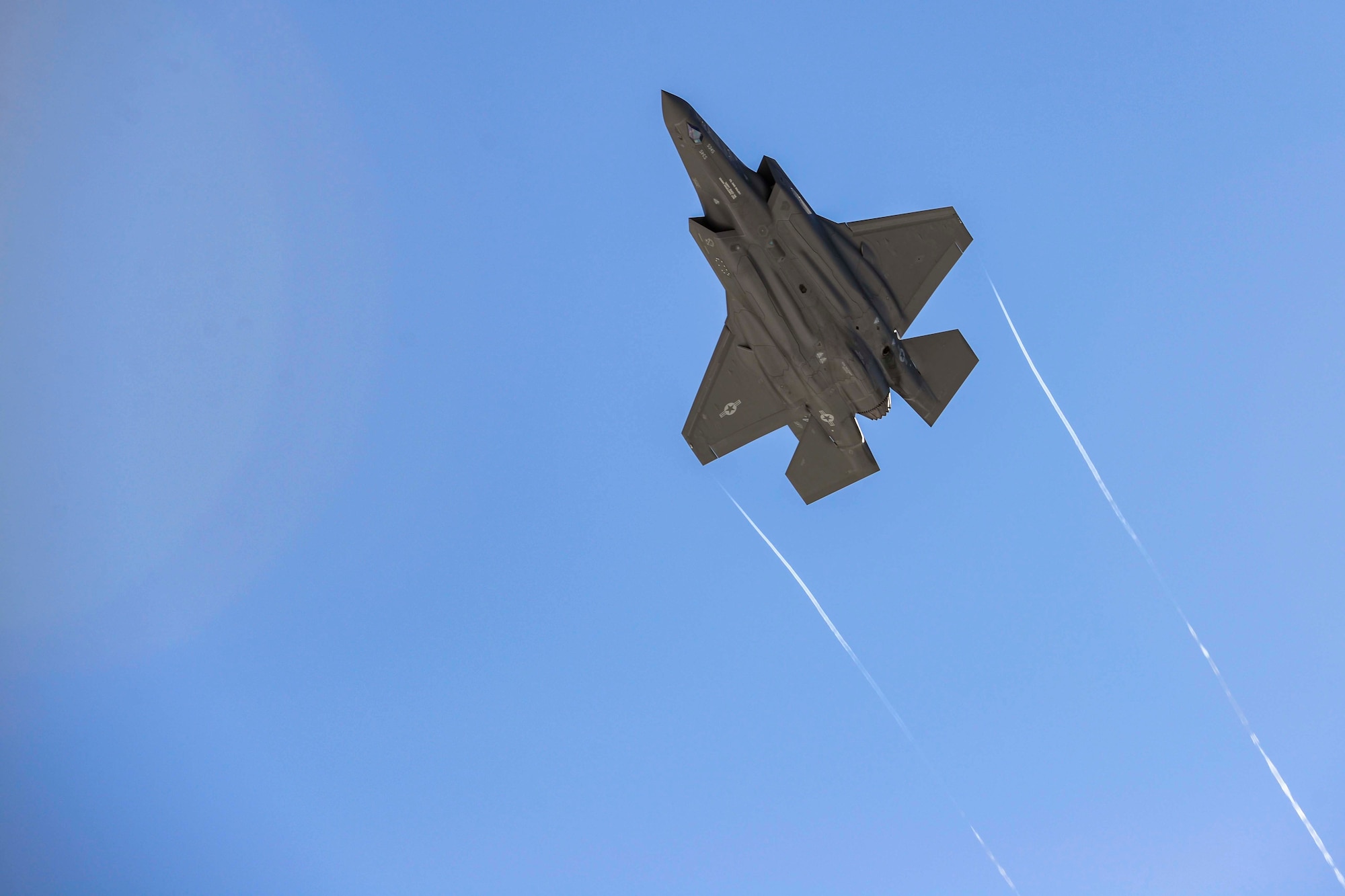 An F-35A Lightning II assigned to the 354th Fighter Wing flies over Eielson Air Force Base, Alaska, April 7, 2021. During AG 21-2, Airmen will be practicing Agile Combat Employment capabilities which will allow them to work dislocated operations and still be able to generate F-35A Lightning II aircraft. (U.S Air Force photo by Staff Sgt. Kaylee Dubois)